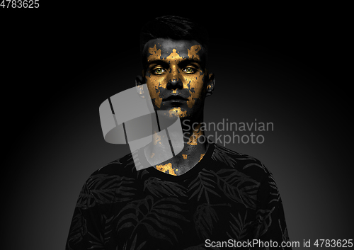 Image of Close up portrait of young man isolated on black studio background