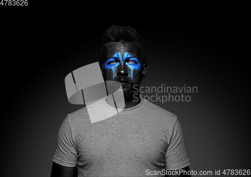 Image of Close up portrait of young man isolated on black studio background