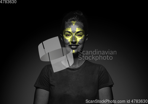 Image of Close up portrait of young woman isolated on black studio background