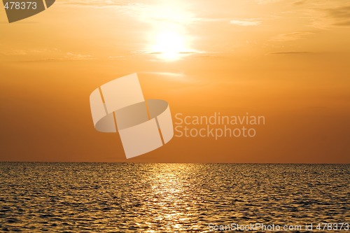 Image of Orange sunset above a quiet serene gulf