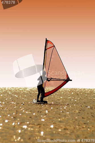 Image of Silhouette a women on a windsurf on waves