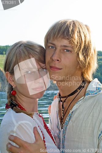 Image of Portrait of the young beauty couple outdoors