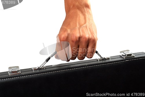 Image of Hand with a black suitcase. Isolated on white 