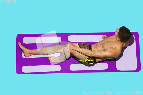 Image of Top view of young caucasian male model\'s resting on beach resort