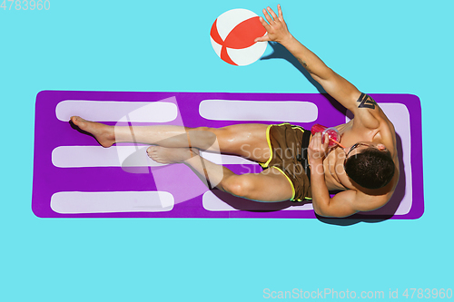 Image of Top view of young caucasian male model\'s resting on beach resort
