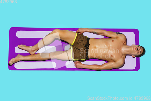Image of Top view of young caucasian male model\'s resting on beach resort