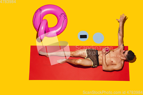 Image of Top view of young caucasian male model\'s resting on beach resort