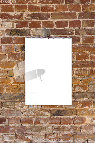 Image of Mock up blank picture or sheet on the brick wall background