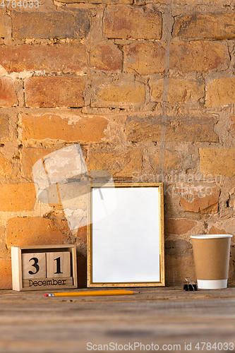 Image of Mock up blank picture or sheet on the brick wall background