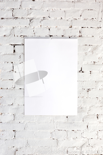 Image of Mock up blank picture or sheet on the brick wall background