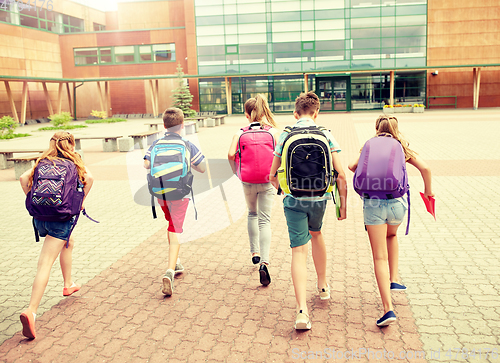 Image of group of happy elementary school students running