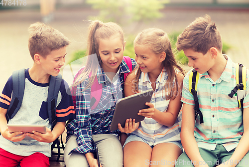 Image of group of happy elementary school students talking