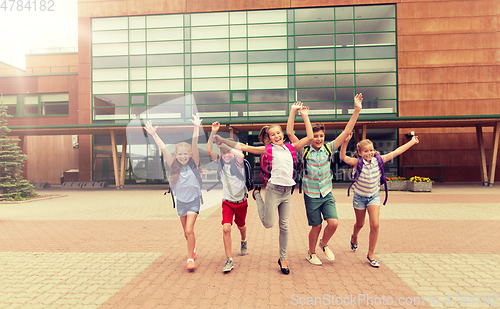 Image of group of happy elementary school students running