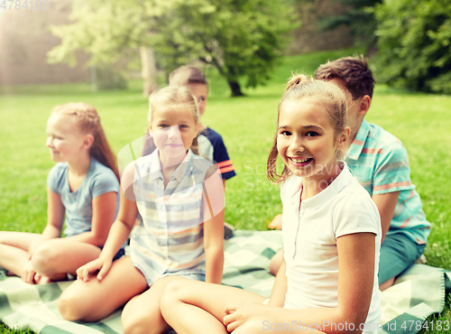 Image of group of happy kids or friends outdoors