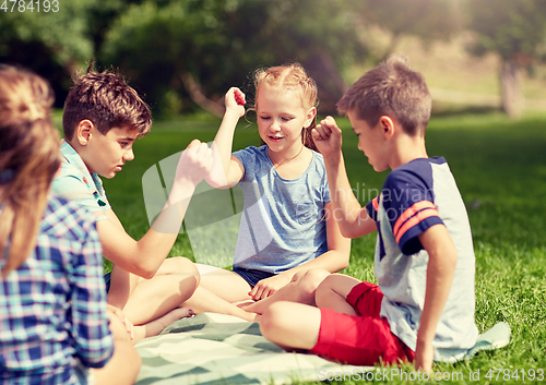 Image of happy kids playing rock-paper-scissors game