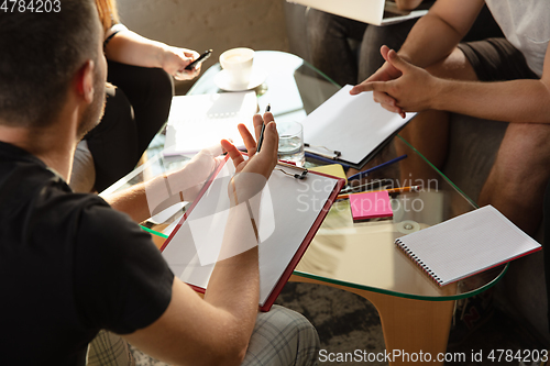Image of Group of young caucasian office workers have creative meeting to discuss new ideas