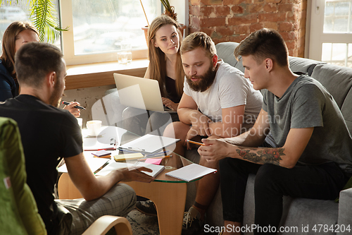 Image of Group of young caucasian office workers have creative meeting to discuss new ideas