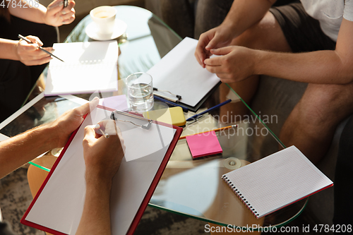 Image of Group of young caucasian office workers have creative meeting to discuss new ideas