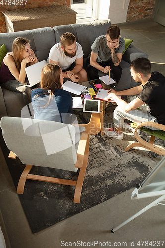 Image of Group of young caucasian office workers have creative meeting to discuss new ideas