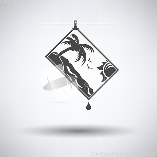 Image of Icon of photograph drying on rope