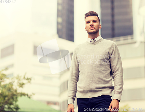 Image of young man on city street