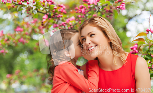 Image of happy mother and daughter whispering her secret