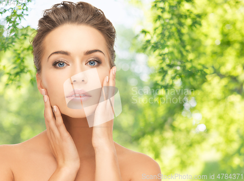 Image of face of beautiful woman over background