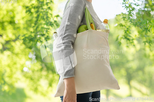 Image of woman with reusable canvas bag for food shopping