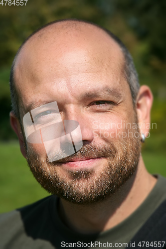 Image of man with beard portrait outdoors
