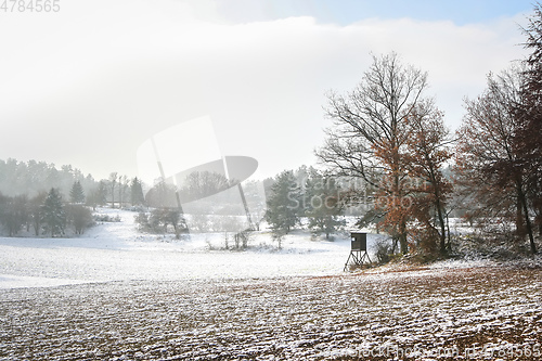 Image of Snowscape with hunter stand