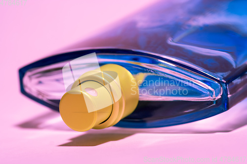 Image of pink perfume bottle head detail