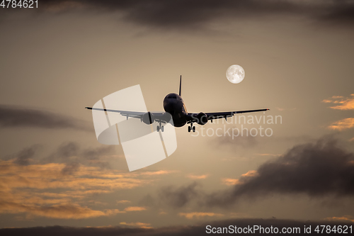 Image of air plane full moon