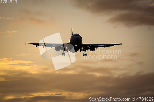 Image of air plane in sunset sky