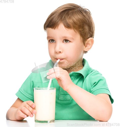 Image of Cute little boy with a glass of milk