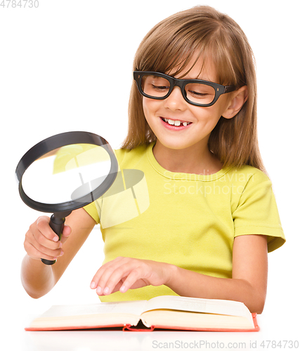 Image of Little girl is reading book