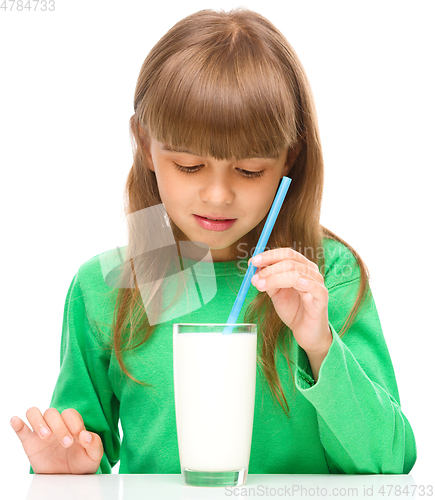 Image of Gloomy little girl doesn\'t want to drink milk