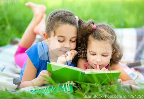 Image of Two little girls are reading book