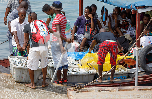 Image of Malagasy peoples loading ship in Nosy Be, Madagascar