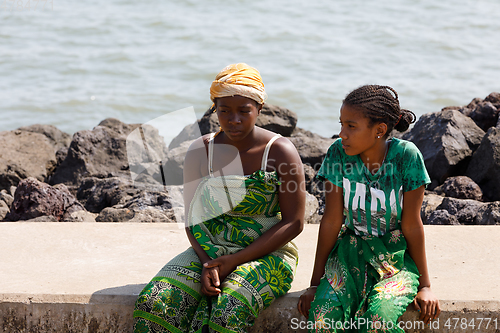 Image of Malagasy woman waiting for transport ship, Nosy Be, Madagascar