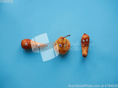 Image of Three funny pears with googly eyes