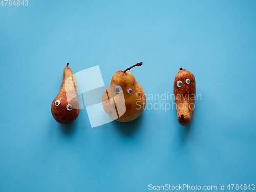 Image of Three funny pears with googly eyes