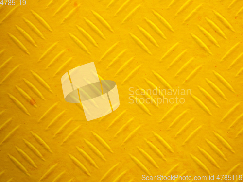 Image of a yellow painted diamond metal plate texture