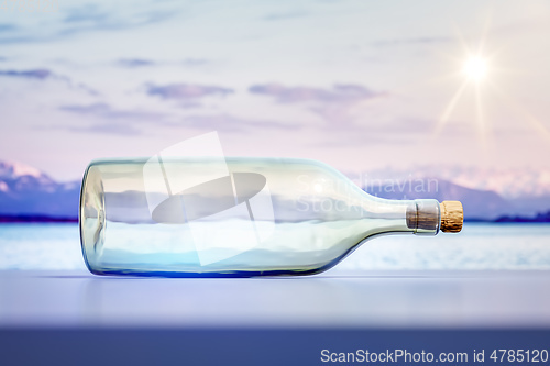 Image of lying glass bottle landscape scenery background