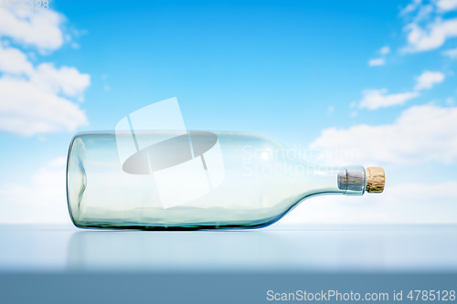 Image of lying glass bottle landscape scenery background