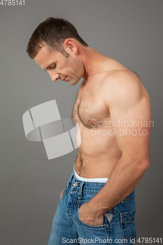 Image of handsome muscle man side view