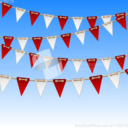 Image of Red and white flags on sky background.