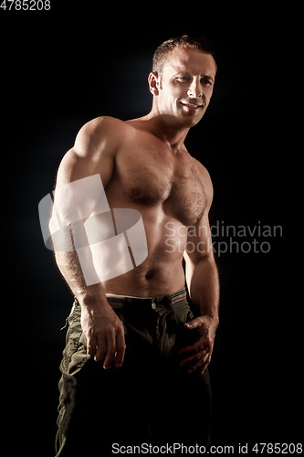 Image of handsome muscle man side view