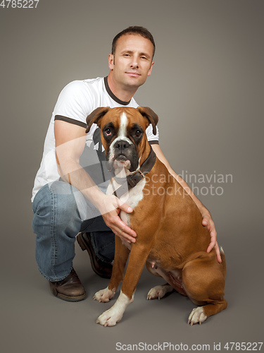 Image of handsome muscle man with his dog