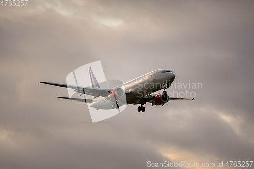 Image of air plane in sunset sky