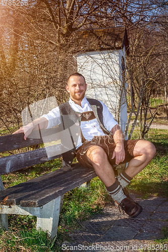 Image of bavarian tradition man in the grass